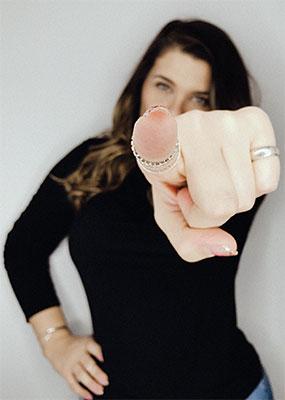 You Are Here By Design - Woman pointing finger at the camera